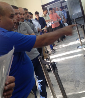 People wait in line at the Foreign Ministry’s office for attesting certificates in Shmeisani, Amman, recently (Photo courtesy of Public Sector Development Ministry)